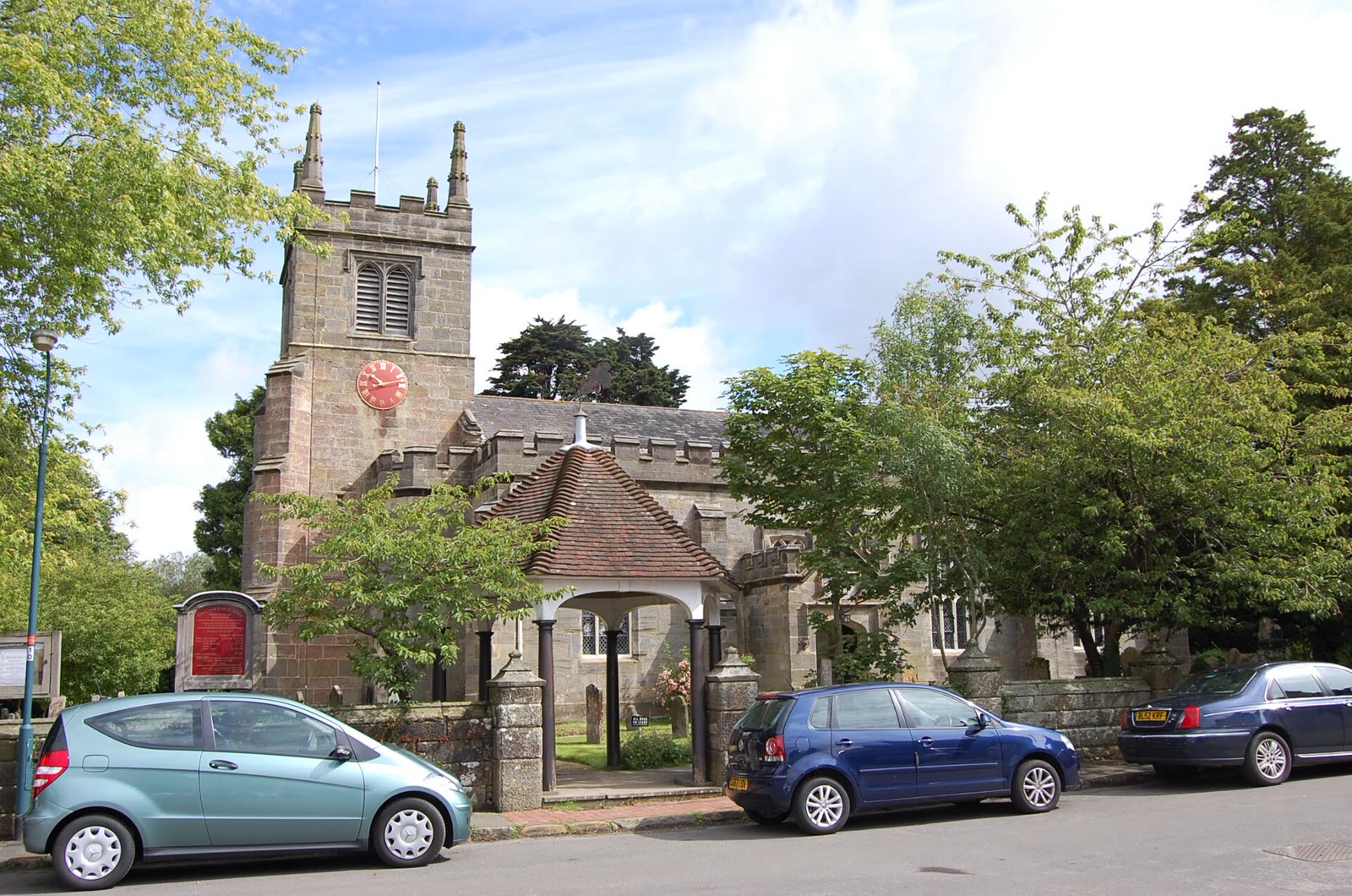 The battlemented west tower of St Alban’s Church, Frant, above the churchyard.