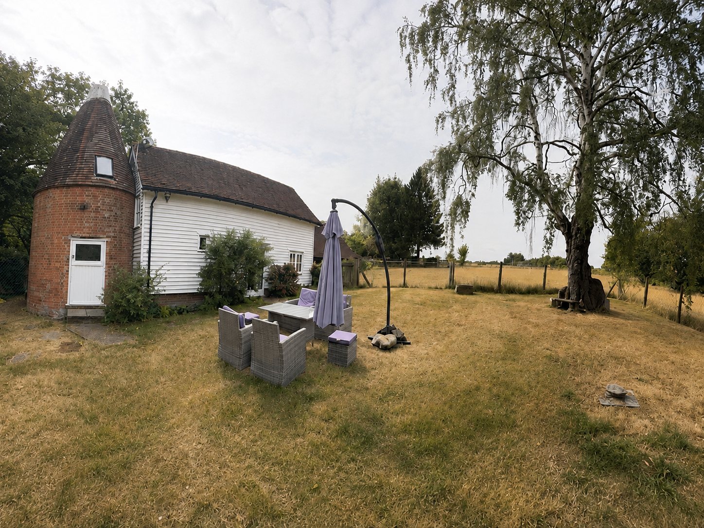 Wide view across the garden beside The Oast.